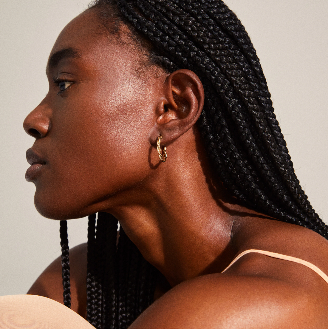 NAJA twisted gold-plated hoop earrings
