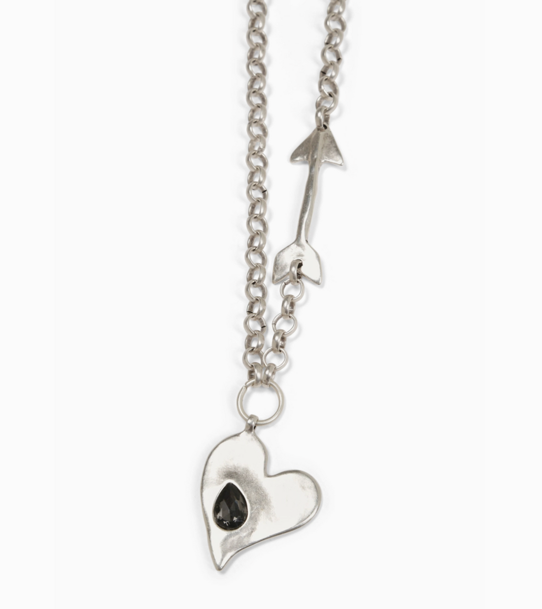 Close Up of Suki’s Wardrobe silver adjustable statement boho style necklace featuring a sculptural heart and arrow pendants on a chunky chain.